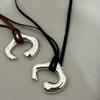 Brown Leather Cord Necklace with Silver Abstract Human Body Pendant – Autumn/Winter Light Luxury Clavicle Chain