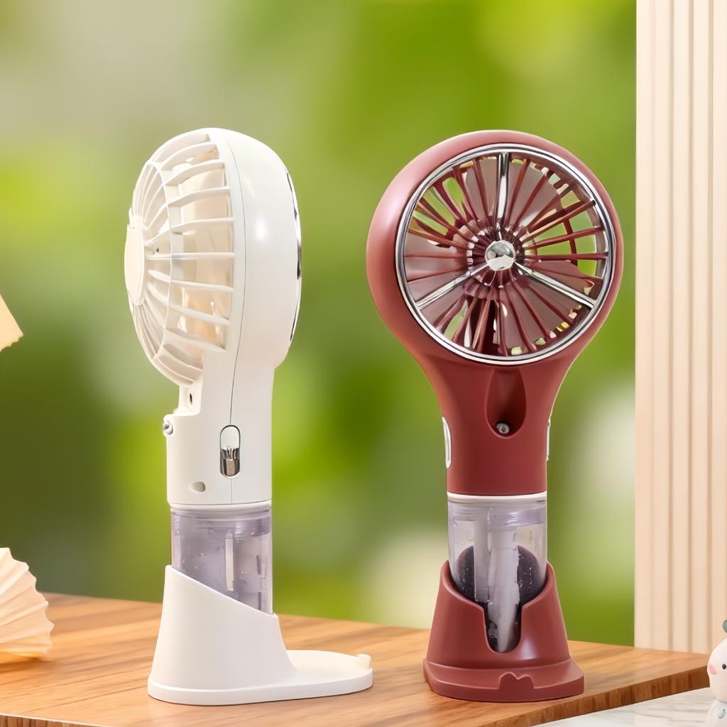Creative New Model Handheld with Base Spray Electric Fan for Outdoor Travel, Sun Protection, Hydration, and Infinitely Adjustable Speed.