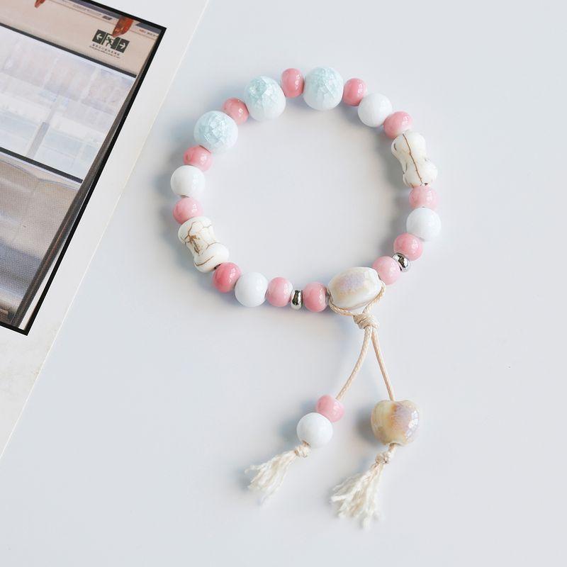 

Цзиндэчжэньский фарфор Розовые бусины Плетеный ручной ремешок Керамический браслет Популярные безделушки Браслет Белый Художественный Студенческий Кисточка Браслет Ice crack Sky Blue
