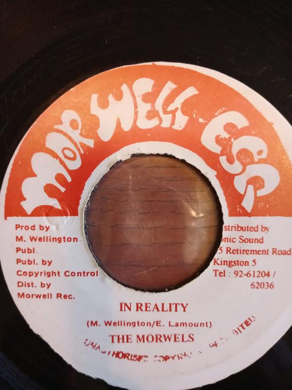 

7-дюймовая пластинка MORWELLS In Reality Reality Dub НЕТ Morwell Esq. Ямайский Регги Ска Даб Б/У