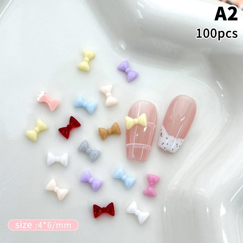 100Pcs 3D Mini Bow Resin Nail Art Decoration Bowknot Ornament Nail Charm Jewelry Design Kawaii Gem