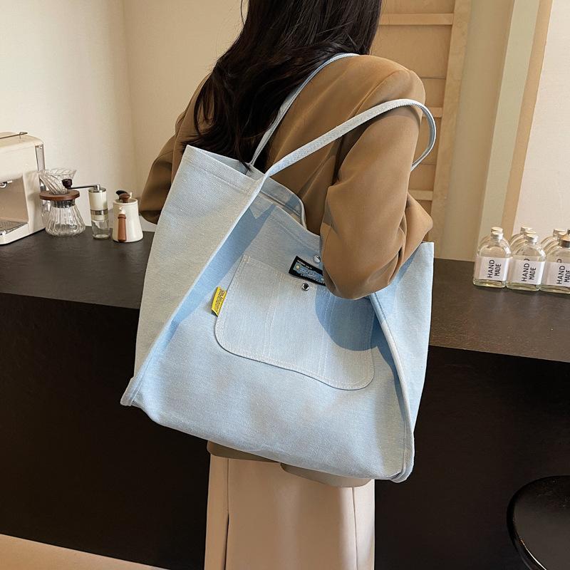 Einfache und großvolumige Denim-Canvas-Tragetasche Damen neue vielseitige Schultertasche tragbare Mode-Einkaufstasche Tide