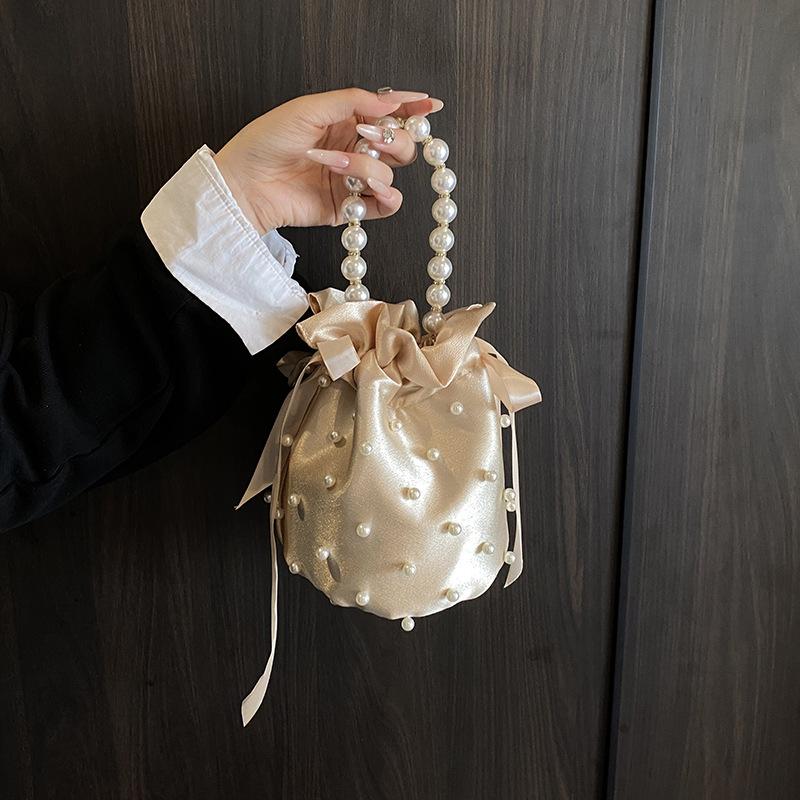 Pearl handbag women's niche design drawstring bucket bag Internet celebrity bridal bag high-end shoulder messenger bag