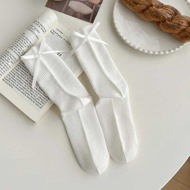 Chaussettes mi-mollet à nœud papillon doux JK japonais pour femmes, chaussettes à nœud au talon, chaussettes décontractées noires et blanches en bouclette, chaussettes de sport en coton pour filles