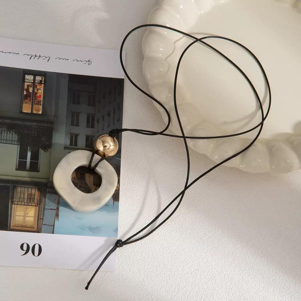 2025 New Chinese Style Unique Resin Pendant Necklace - Retro Niche Long Sweater Chain for Women