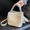 Elegant Mini Crossbody Bag Women Leather Bucket Bag with Braided Top Handle and Ball Accent for Casual Outings