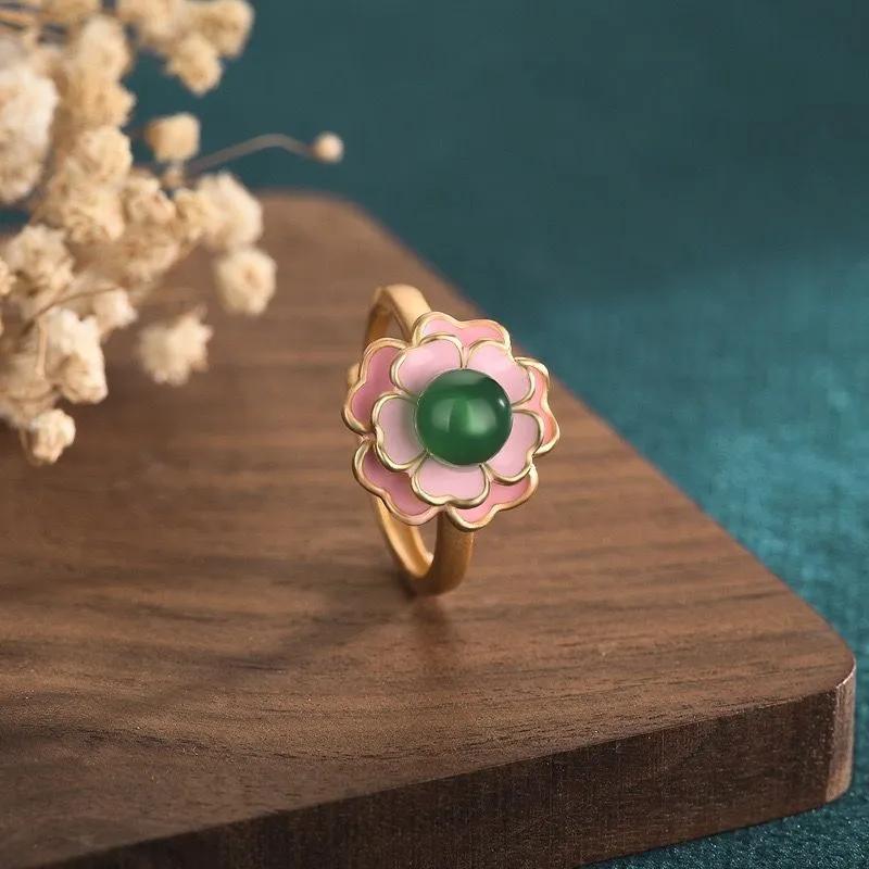 A -plated Camellia, Agate, And Chalcedony Ring With A Court Design. One Size