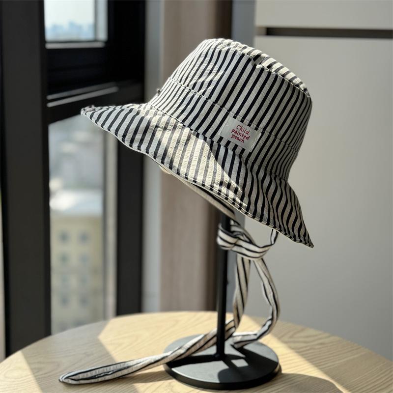 

New Korean-style striped lace-up fisherman hat for women, summer large brim, UV protection, double-sided, versatile hiking hat Adult54-60Adjustable чёрный