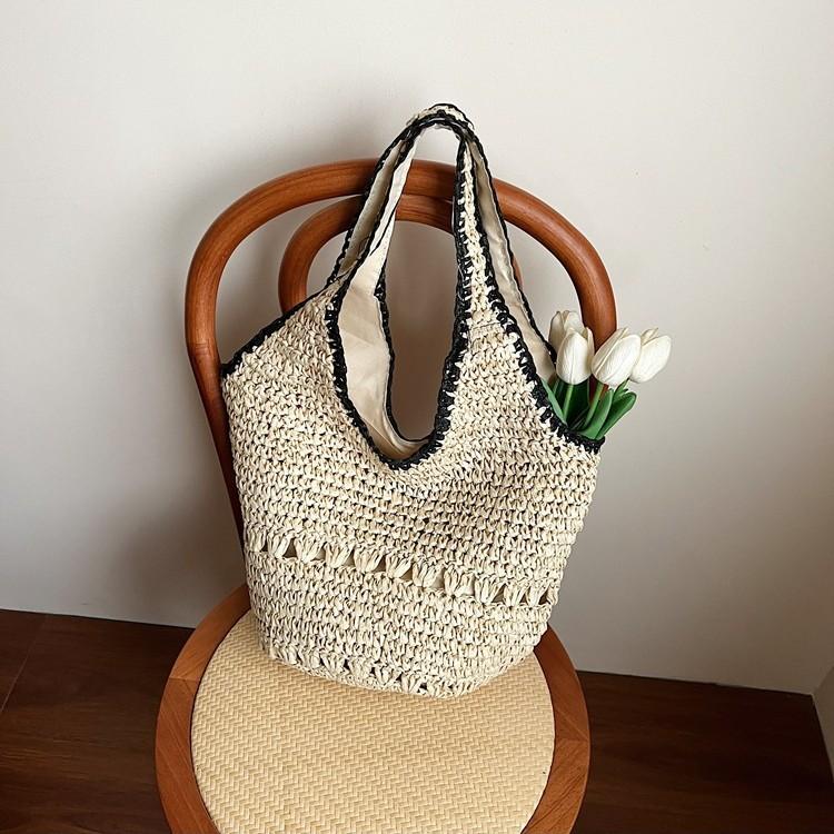 Niche woven bag women's new casual summer vacation straw bag large capacity portable shoulder armpit bag
