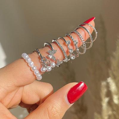Ensemble de 9 bagues d'articulation papillon strass et perle pour femmes