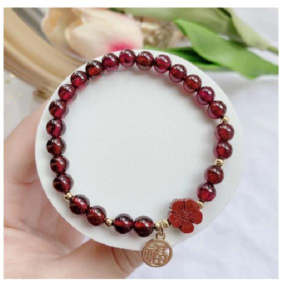Here's a small red flower for you: a hand-woven bracelet made of cinnabar red garnet, the same style as the one featured on Little Red Book