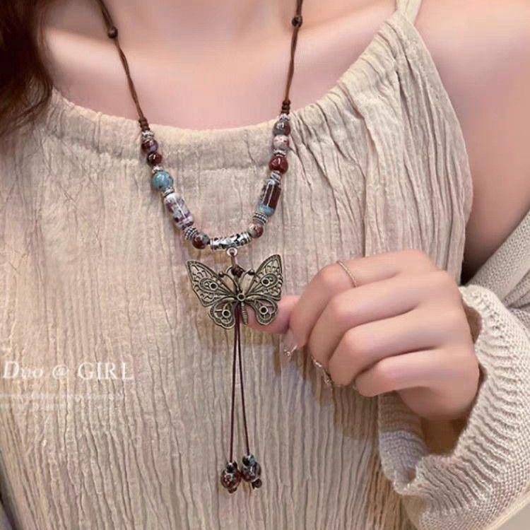 Ceramic butterfly rose woven necklace women's new retro accessories can be drawn long graduation gift