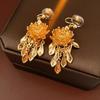 Boucles d'oreilles à clip pompon feuille de lotus plaqué or Boucles d'oreilles haut de gamme pour femmes Nouveau style chinois Zircon pour mariée de femmes anciennes
