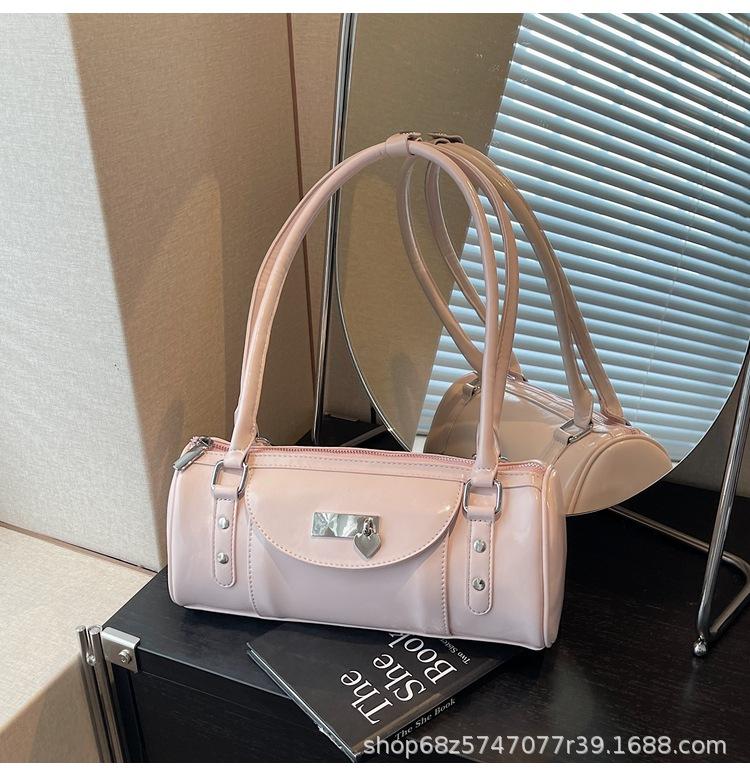 

Niche high-end bowling handbag women s 2025 new fashion versatile Spice Girl commuter shoulder oblique span bag рожевий