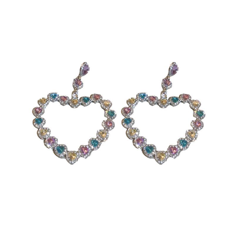 Silver Needle Exaggerated Heart Earrings with Hollow Diamond Design - Luxury European & American Style for Women