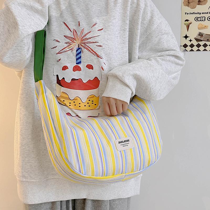 

Canvas bag female student shoulder dumpling bag trendy new casual commuting versatile messenger crescent bag жёлтый