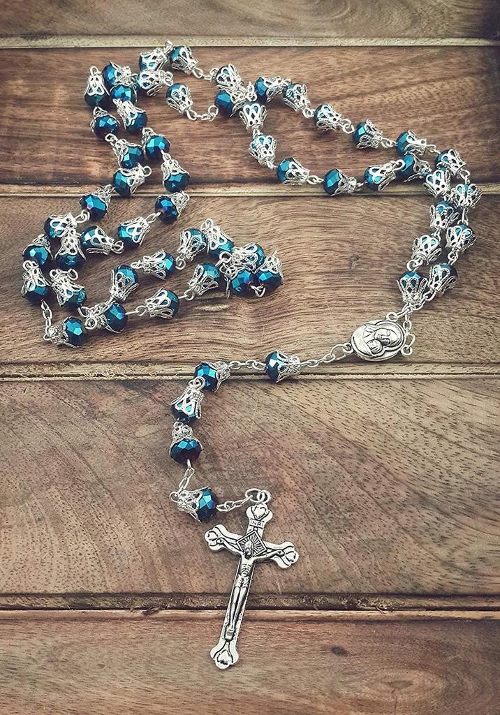Catholic necklace with deep blue crystal crown beads, rosary, sacred earth medal and cross.