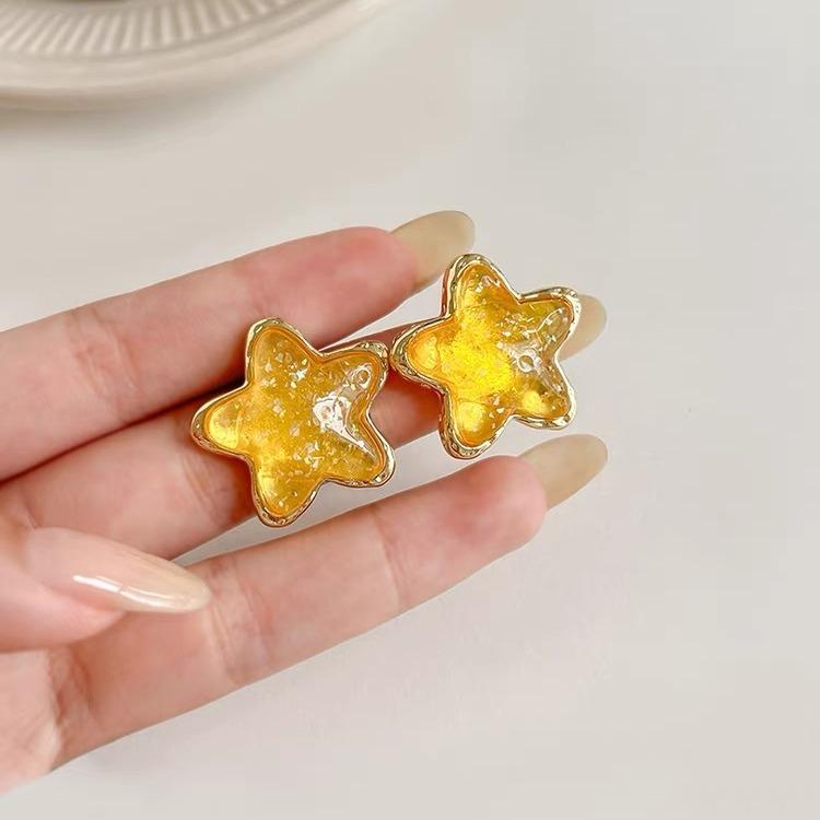 

Yellow star stud earrings new light luxury high-end earrings niche cute sweet summer dopamine earrings