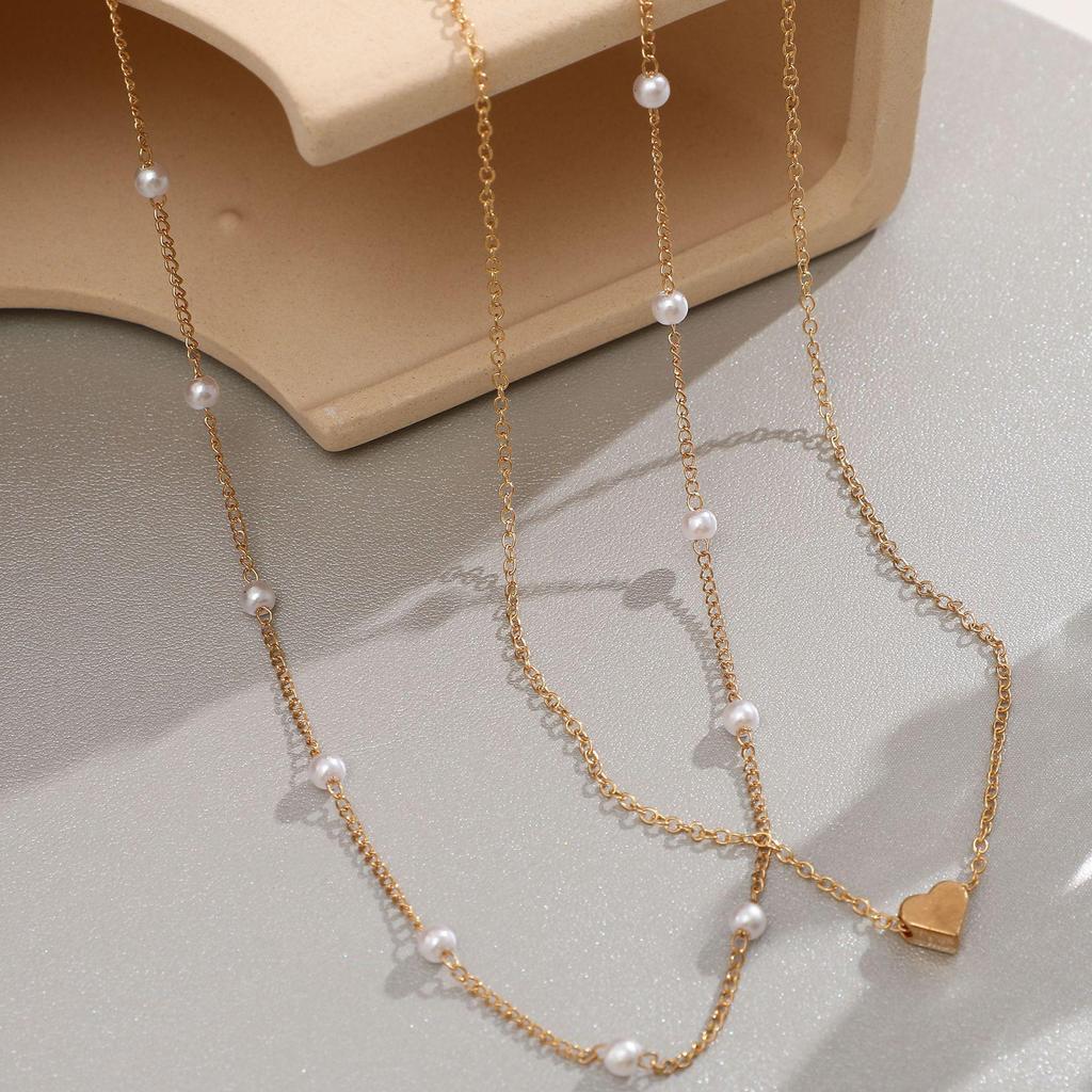 Collana di Tendenza a Doppio Strato: Collana clavicola Cuore di Pesca in Rame e Perla Sintetica