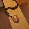 Golden Fu Compass Pendant: Chinese Auspicious Hollow Round Necklace with Black Rope.