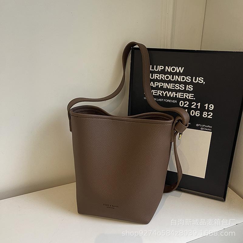 

Solid color retro underarm bag women s new trendy fashion Korean bucket bag solid color large capacity commuter tote bag