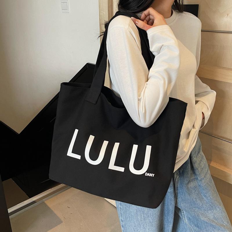2025 autumn new portable shoulder canvas bag fashionable simple letter trend commuter large capacity shoulder bag