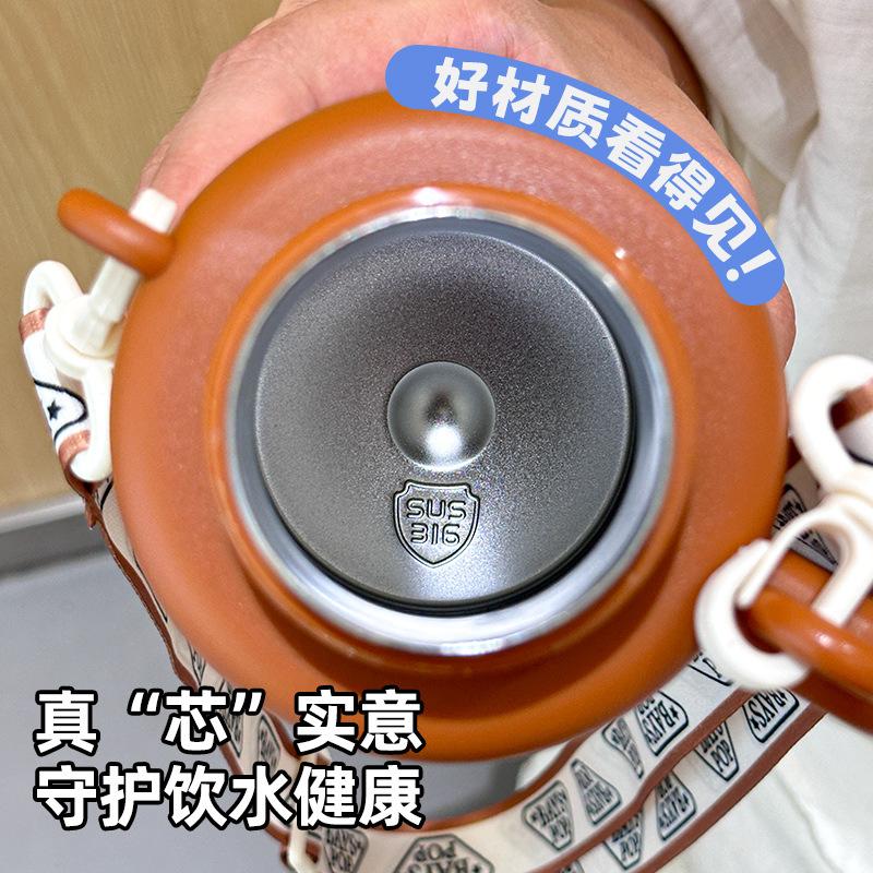 Double-layer vacuum thermal insulation water cup, cute children's thermos cup, portable strap, handle, double drinking pot.