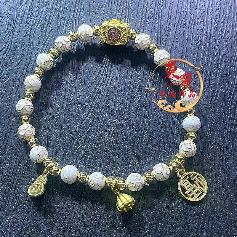 Lotus Pod & Ji Character White Cloisonné Enamel Bracelet with Ash-Toned Porcelain, Gold Foil Filigree, and Luck Beads.