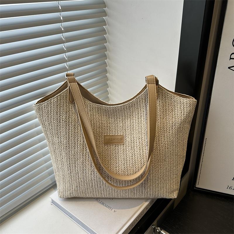 

Large capacity bag women s summer 2025 new handwoven straw bag commuter shoulder seaside vacation beach bag