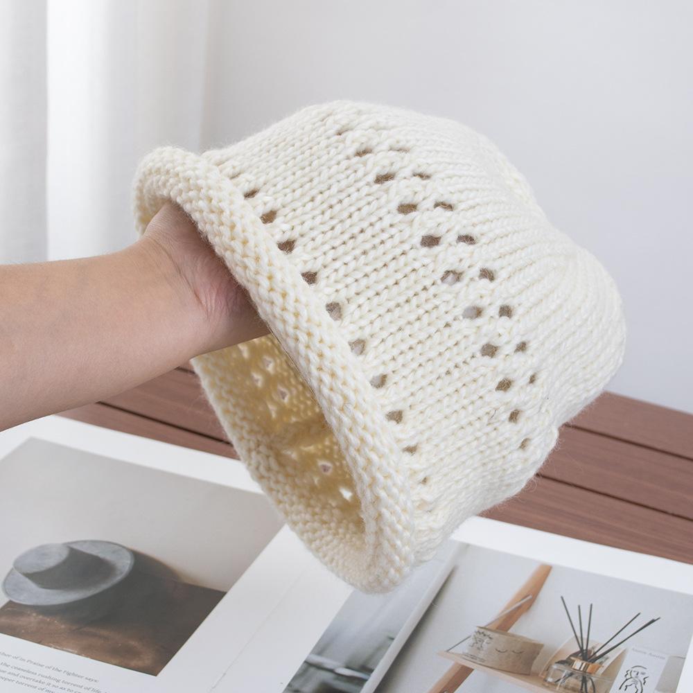 Solid color crimped hollow knitted headgear women's autumn new versatile wool hat loose pullover cold hat