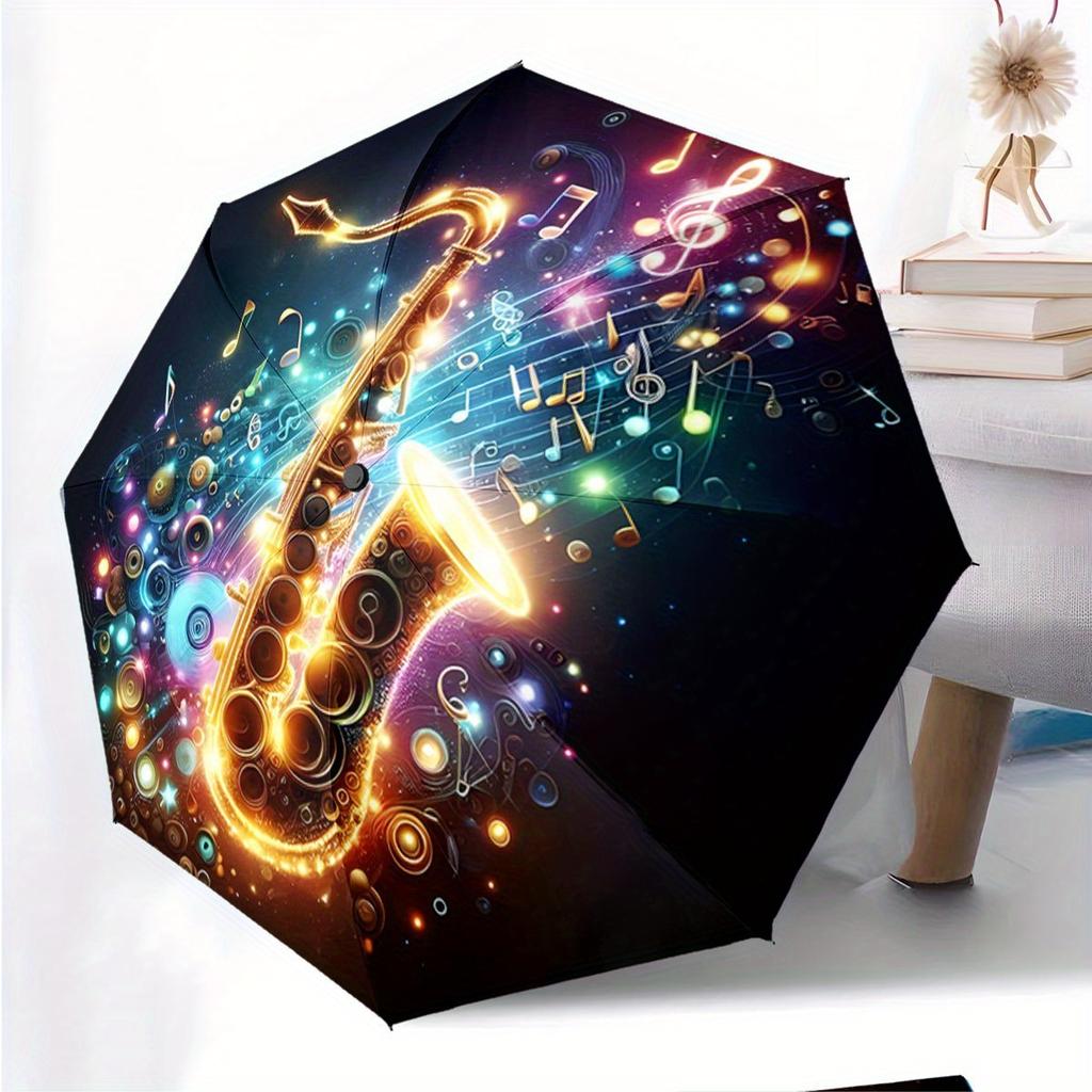 Automatic Folding Umbrella The umbrella features a vibrant saxophone surrounded by musical notes and colorful swirls. Portable