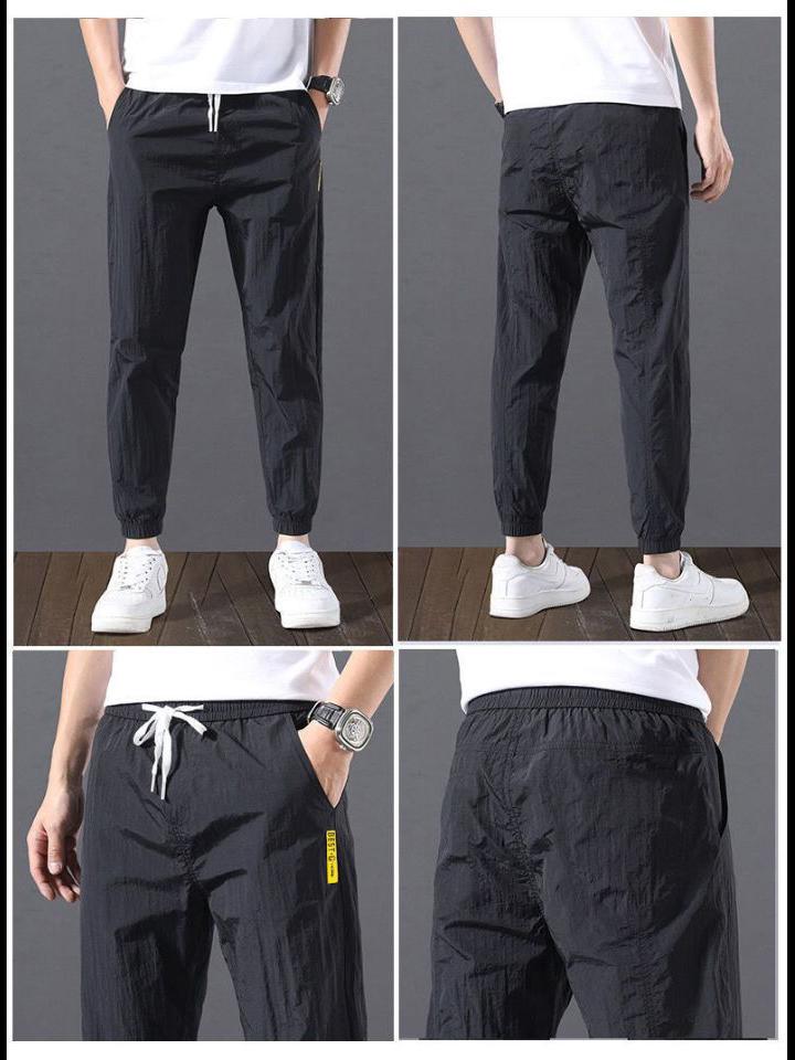 2023 Men's Korean-Style Ice Silk Casual Pants, Quick-Drying, Trendy, Loose-Fit Nine-Point Sports Pants for Summer.