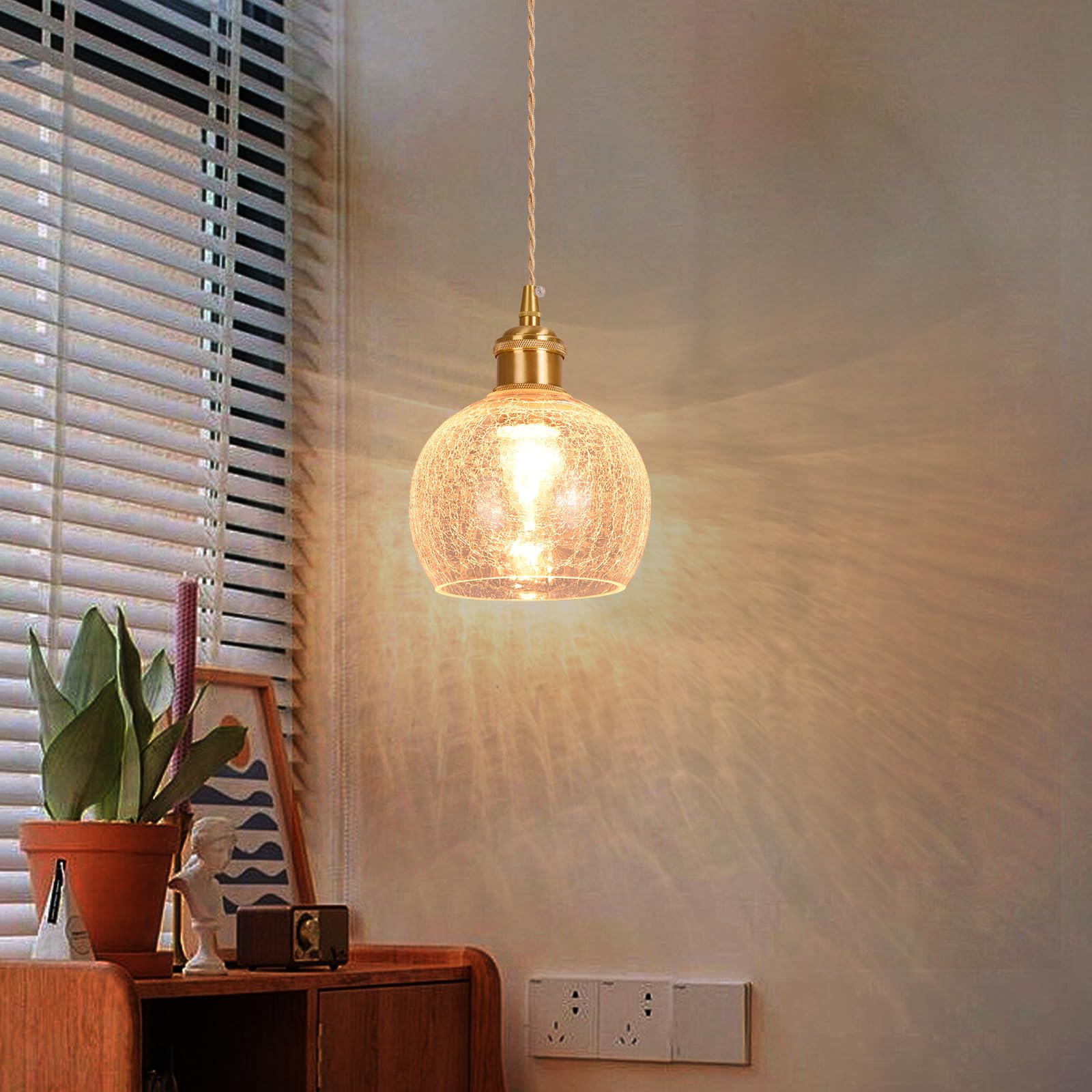 

Stylish glass pendant light with a hook-and-loop ceiling mount, adjustable cord, E26 LED compatible, brass ball-shaped design with a cracked glass