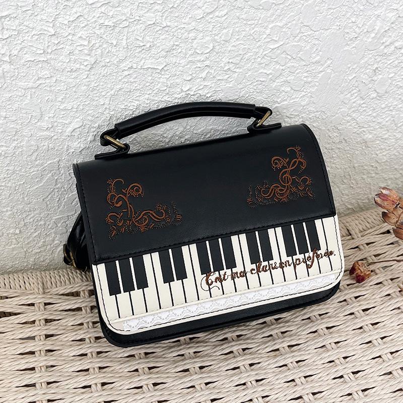 Bolso de mensajero de encaje de piano literario retro de alto valor, bolso de mano versátil, mochila simple, maletín, bolso de hombro