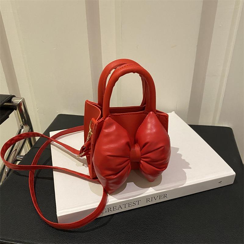 Niche bow solid color new mini hand carry small square bag summer beautiful retro shoulder messenger bag women