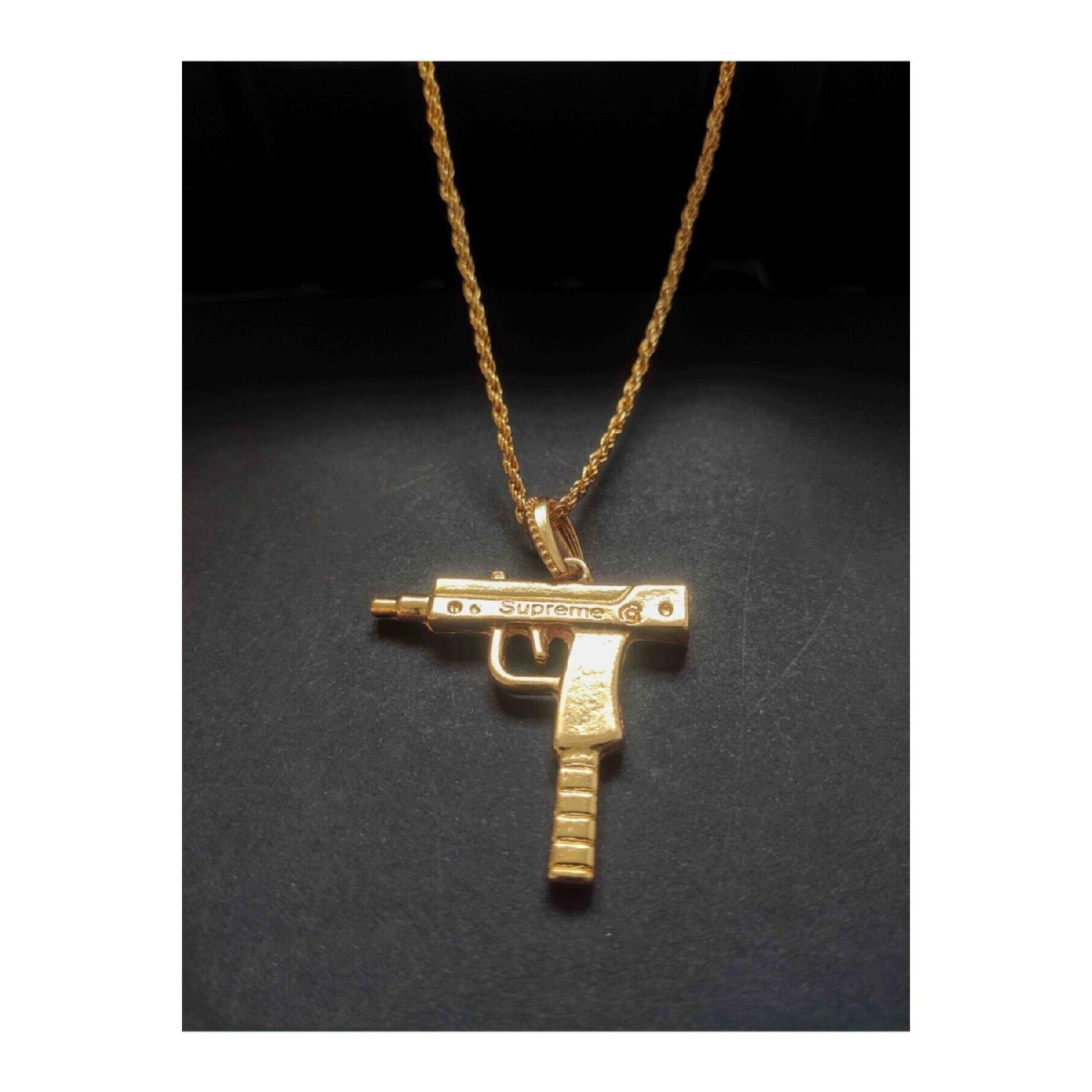 

Мужское ожерелье золотого цвета с головкой Узи