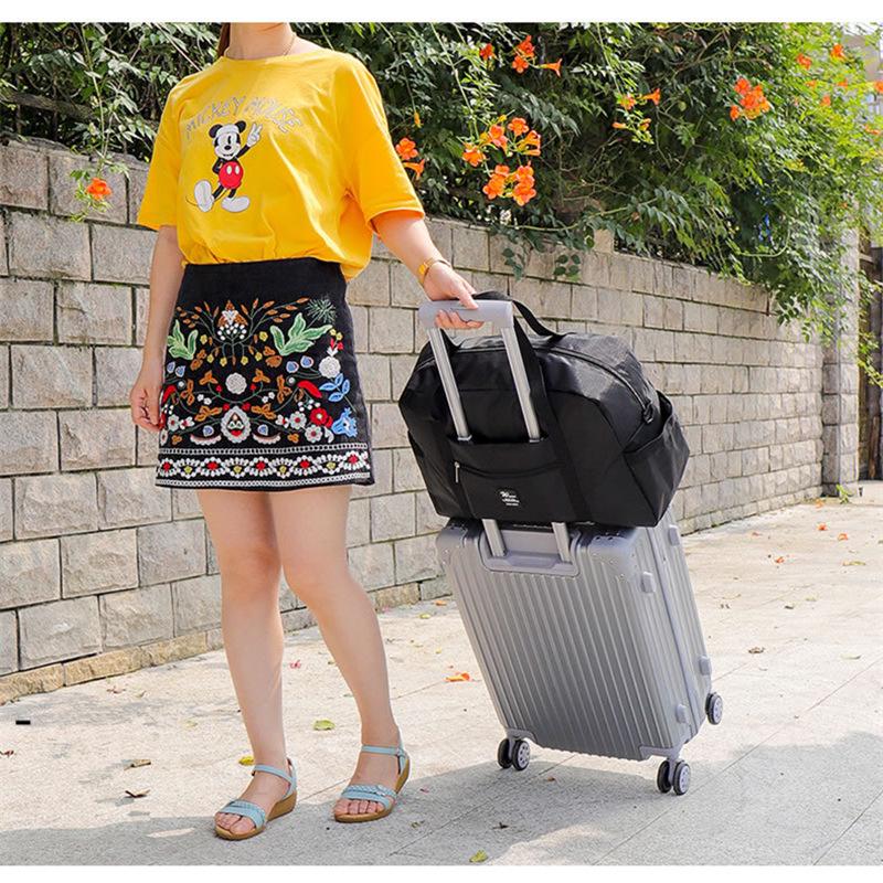 Trendy Waterproof Folding Travel Bag: Large Capacity Trolley Luggage & Fitness Storage