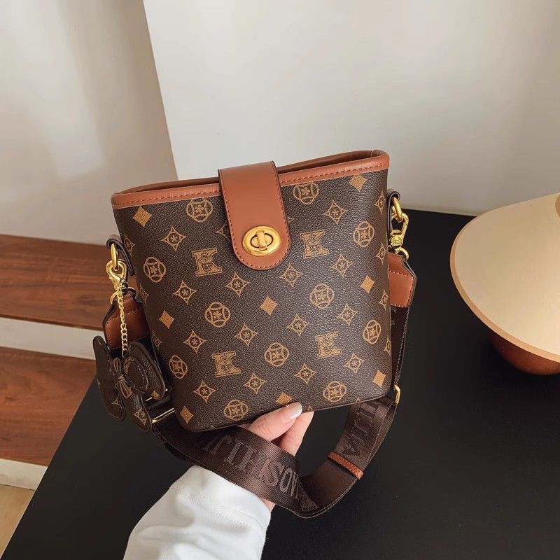

Fancy Niche Style Bucket Bags Women s 2025 Summer New Arrival Fashion Shoulder Small Bag Print Wide Shoulder Strap Crossbody Women s Bag Brown