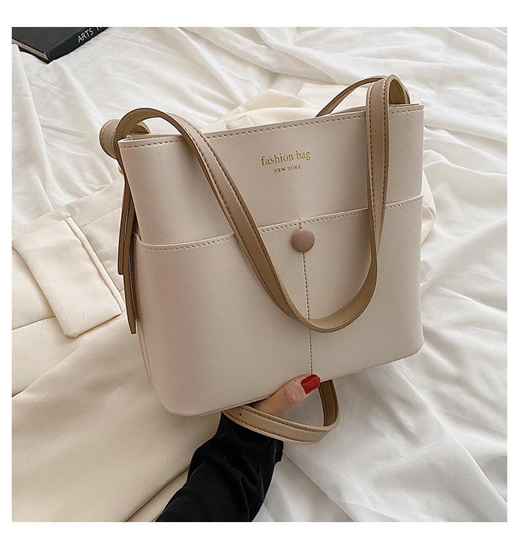 

Solid color pu women s tote bag 2025 new Internet celebrity fashion high-end foreign style bucket bag versatile shoulder messenger bag