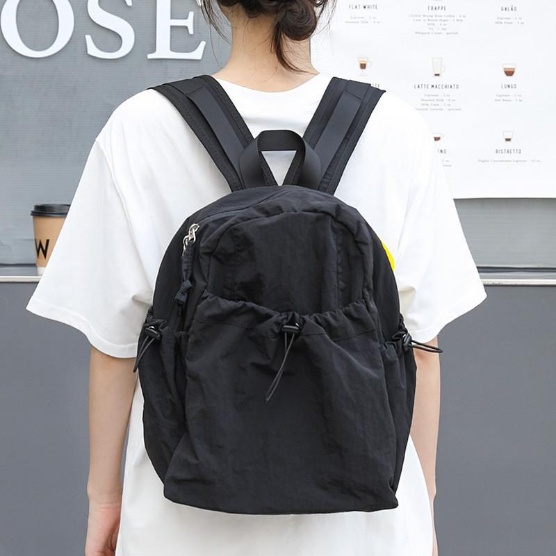 IELGY Korean version of casual literary canvas schoolbag, pleated nylon drawstring backpack, fashionable Oxford cloth backpack.