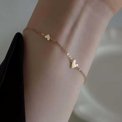 Elegantes Drei-Herz-Armband aus S925 Sterlingsilber mit 18K Gold: Leichter Luxusstil