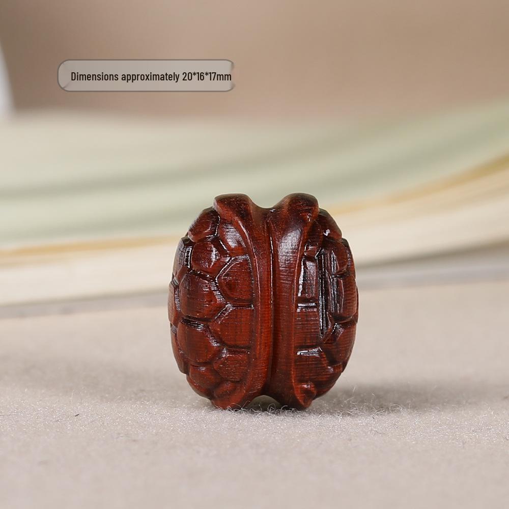 Брелок-подвеска из палисандра с резной бусиной из панциря черепахи