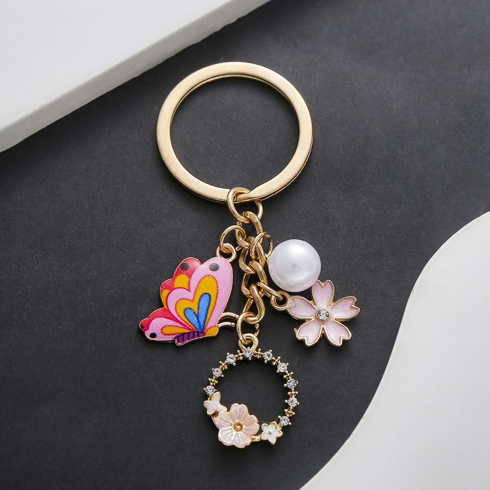 Pink Butterfly Pearl Flower Keychain with Cartoon Oil Dripping Design