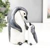 A Set of Two Resin Statues Featuring a Mother And Penguin Showcasing a Creative Family Theme These Can Serve As Decorative Pieces for Home
