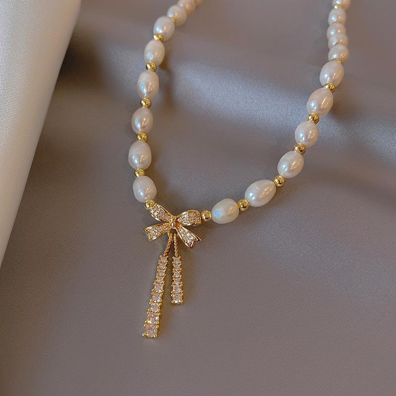 

Rice Grain Freshwater Pearl Necklace Women S Fashion Micro-Inlaid Bow Collarbone Chain Copper Bead Interval Design Neck Chain