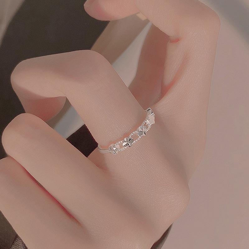 Fashionable Versatile Four-Leaf Clover Hollow Ring for Women - High-End Light Luxury Hand Jewelry 2025 Niche Design