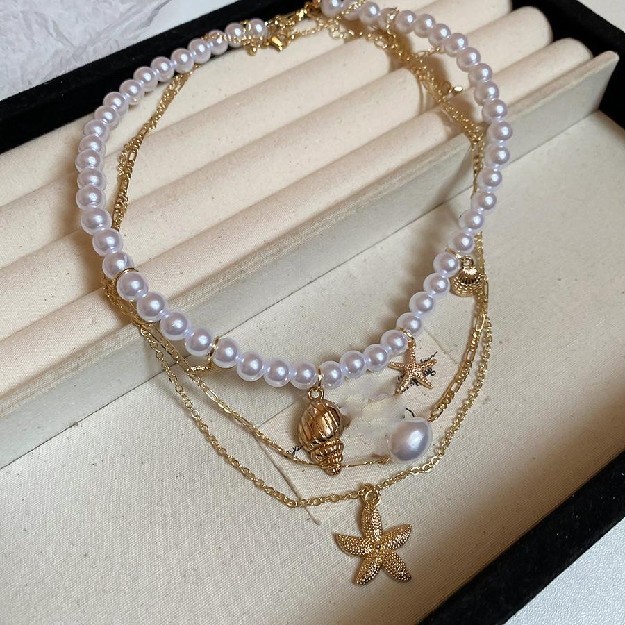 

Подвеска-кулон из жемчуга в виде морской звезды и раковины, модная, праздничная, с темпераментом, цепочка на ключицу, легкая роскошь, универсальная, нишевая бижутерия
