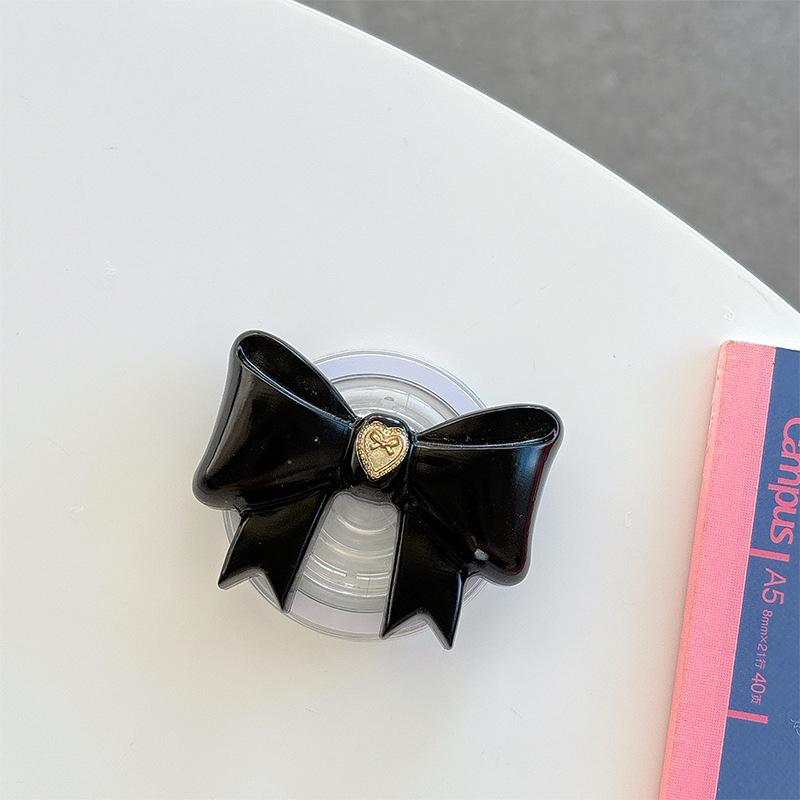 Small Love Three-Dimensional Bow Mobile Phone Airbag Bracket Magnetic Suction Telescopic Folding Desktop Bracket Wind
