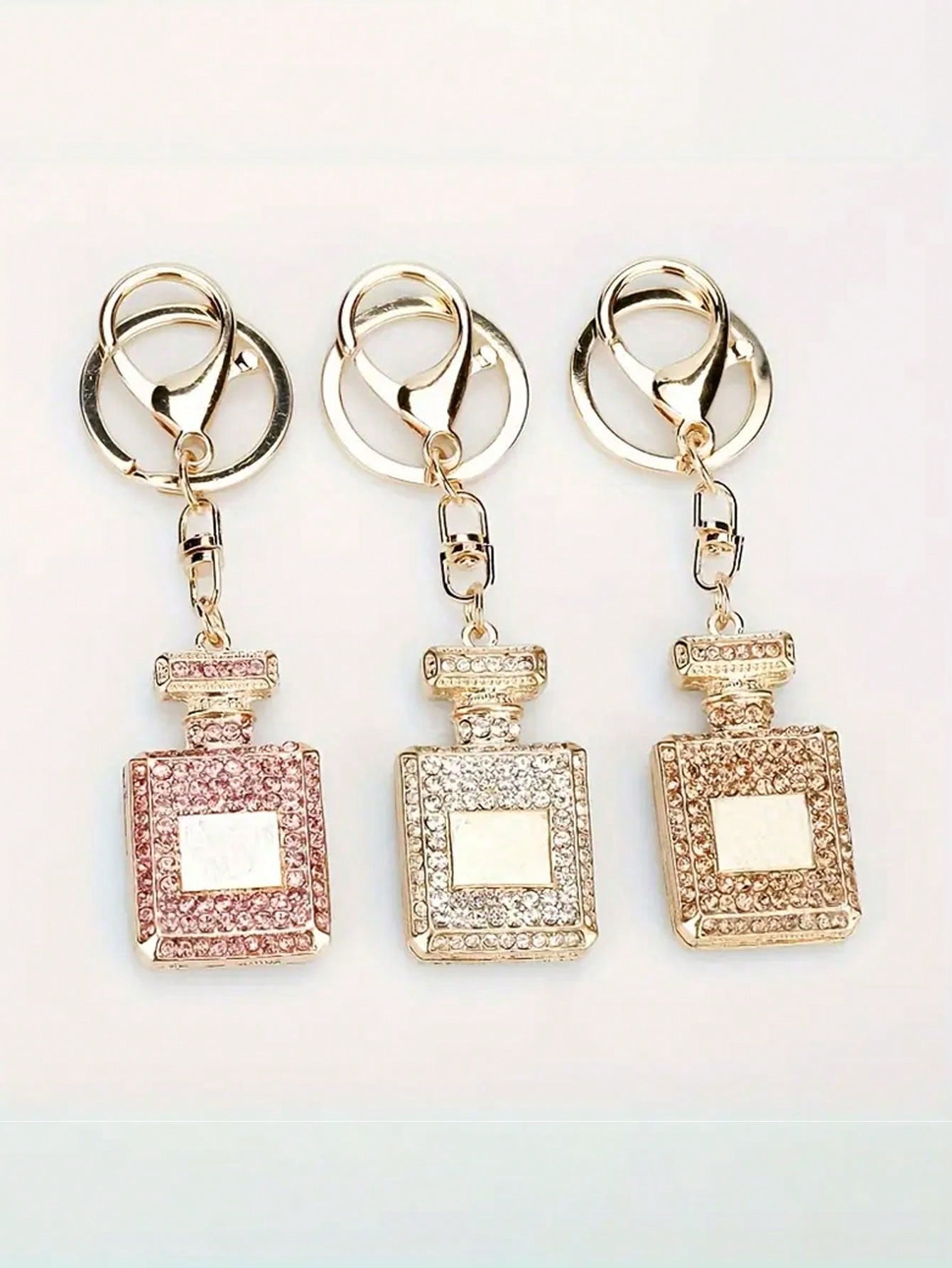 

Creative And Fashionable Rhinestone Car Pendant Keychain Rhinestone Perfume Bottle Ladies Bag Pendant Accessories Gifts рожевий