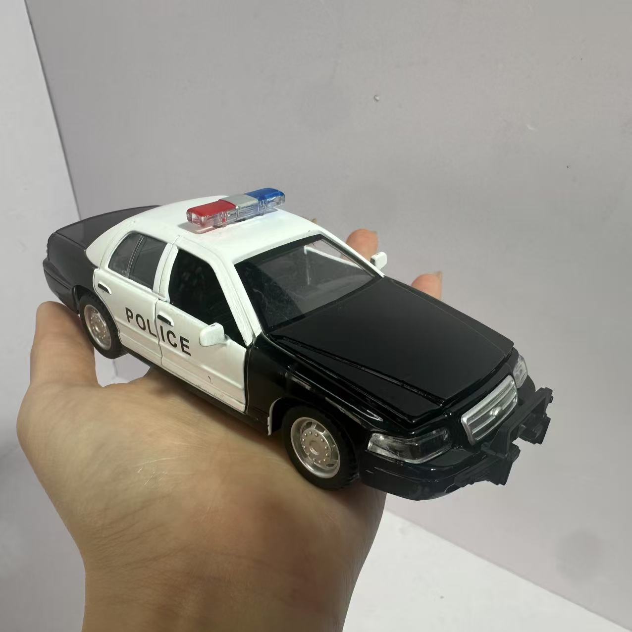 

Interactive Police Car Model Toy with Sound And Light Effects for Kids